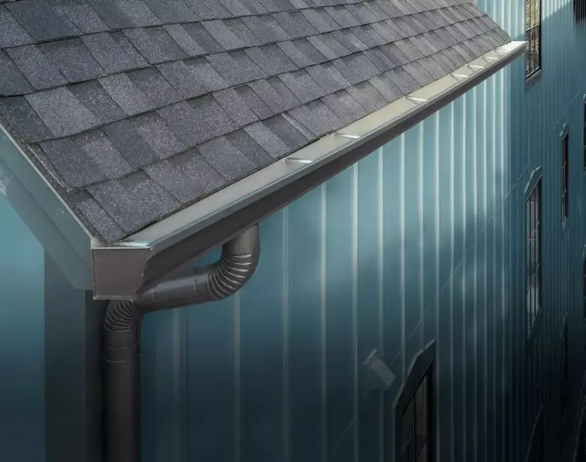 Seamless aluminum gutter and roofline drainage detail on an Alpine Utah home